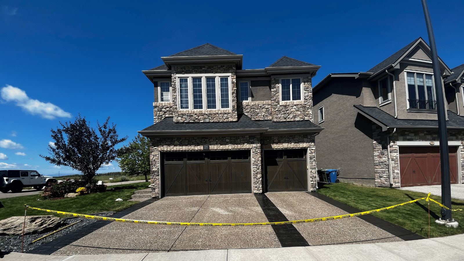 Stunning newly sealed Calgary driveway with clean modern home