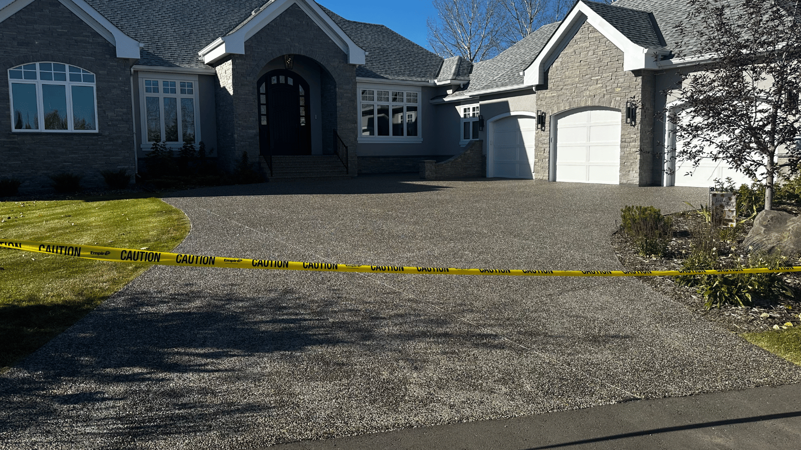 Close-up of sealed exposed aggregate driveway showing protection and color